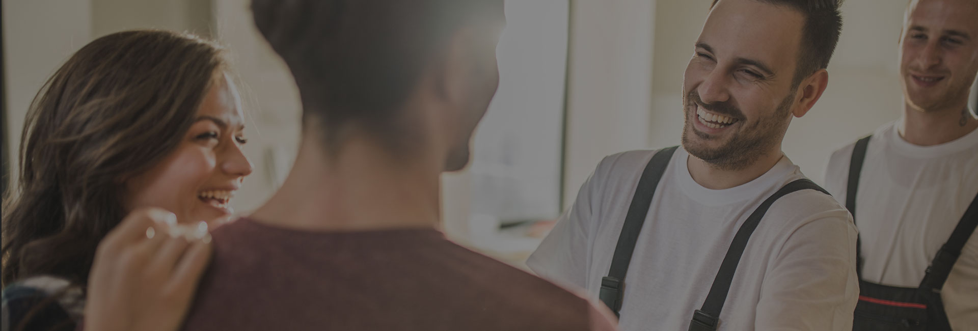 Couple and construction workers smiling